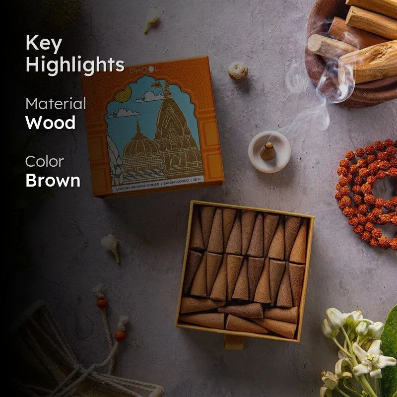 Brown incense cones in an orange box with a smoking cone beside it