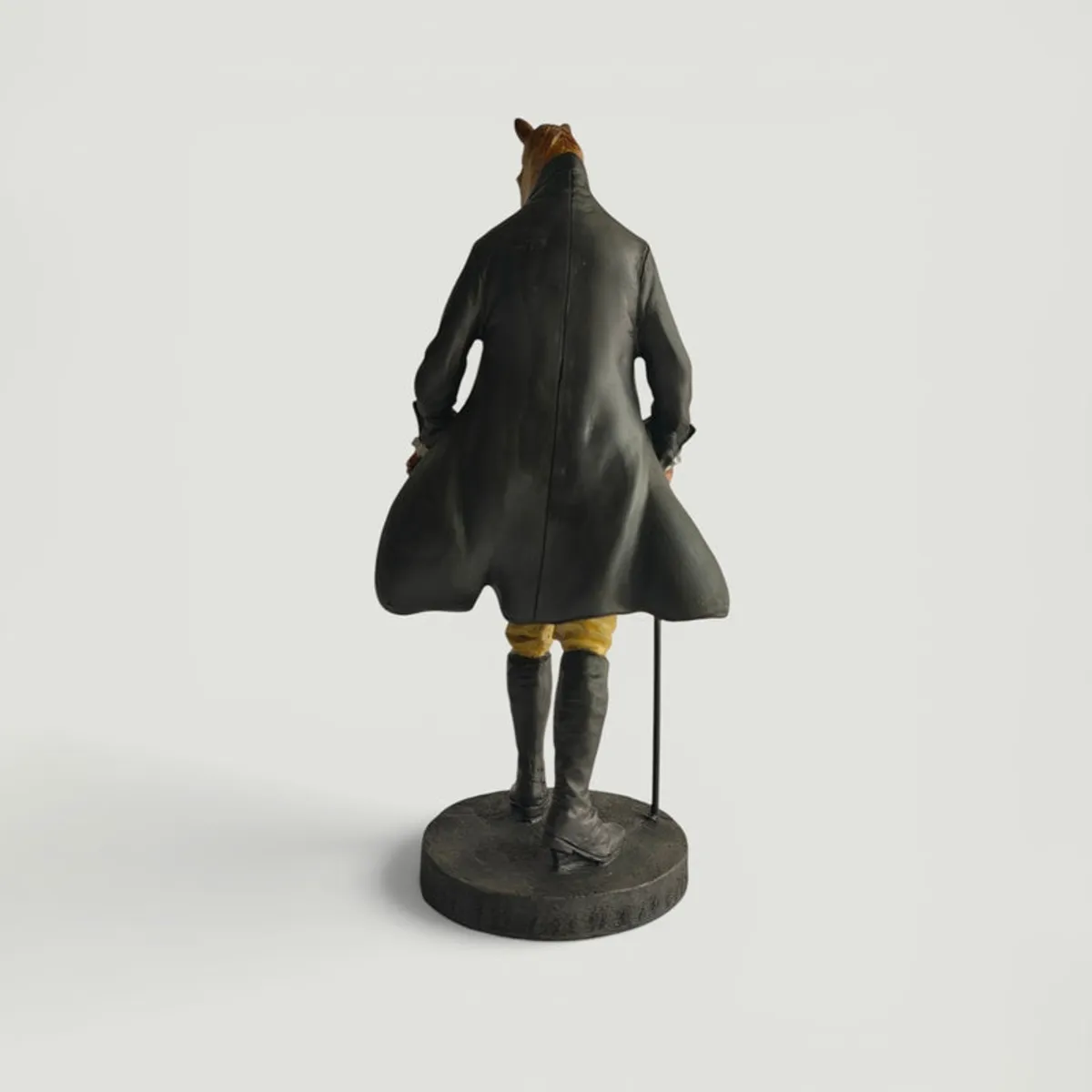 Back view of the horse-headed gentleman showpiece on a plain background