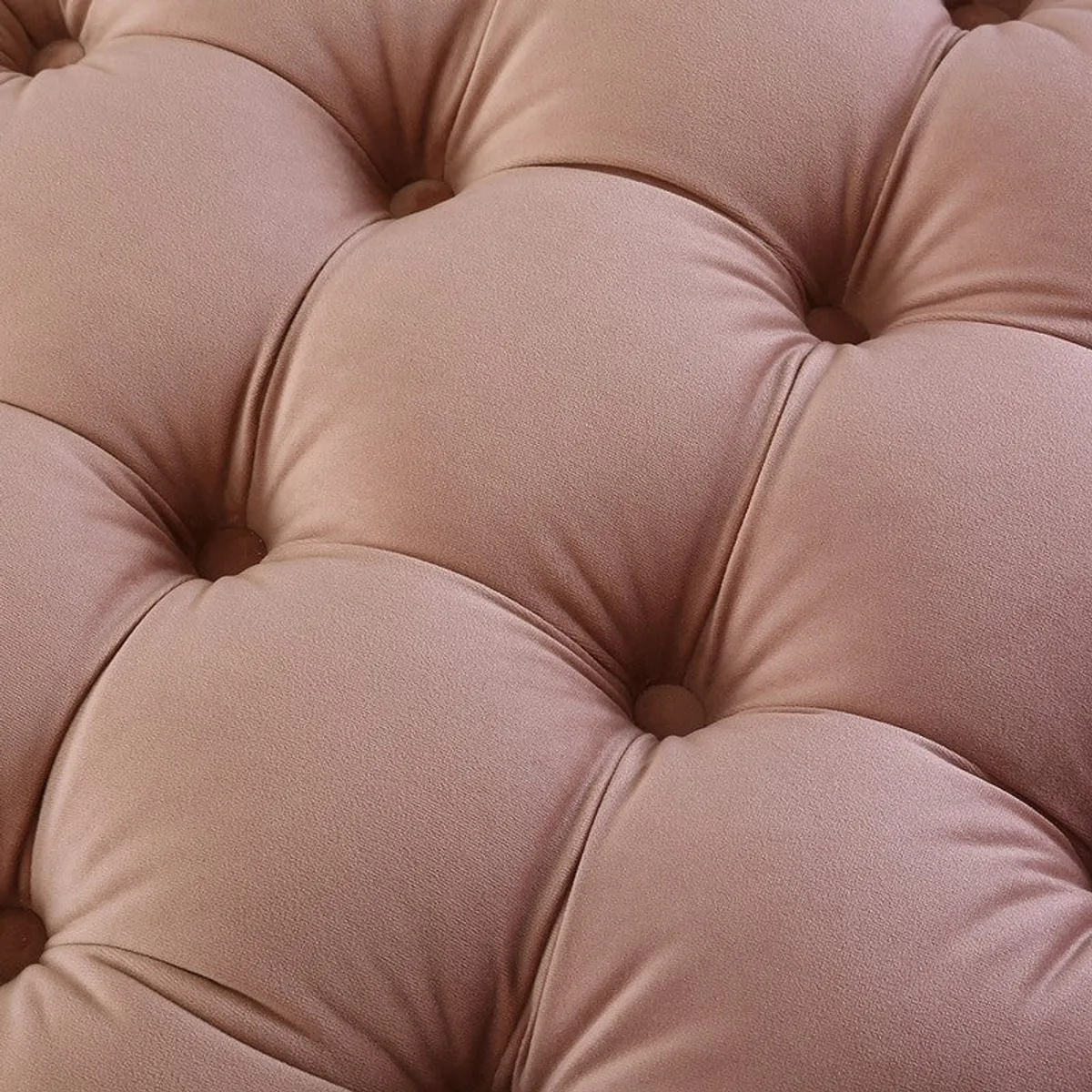 Close-up of the tufted top surface in pink velvet