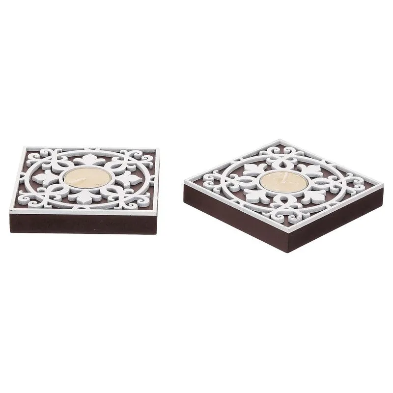 Side view of two square wooden tea light holders on a white background