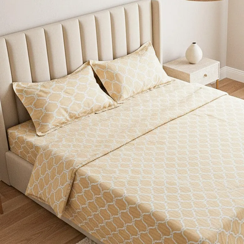 Close view of the yellow-gold geometric bedsheet with matching pillow covers