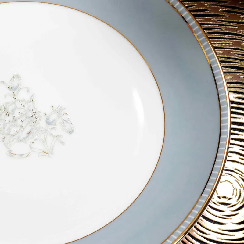 Close-up showing delicate floral artwork on a white porcelain plate with grey and gold edging