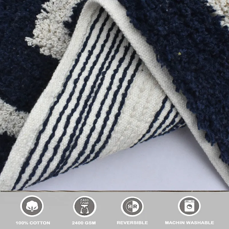 Close-up of the bath mat underside showing blue and white striped backing