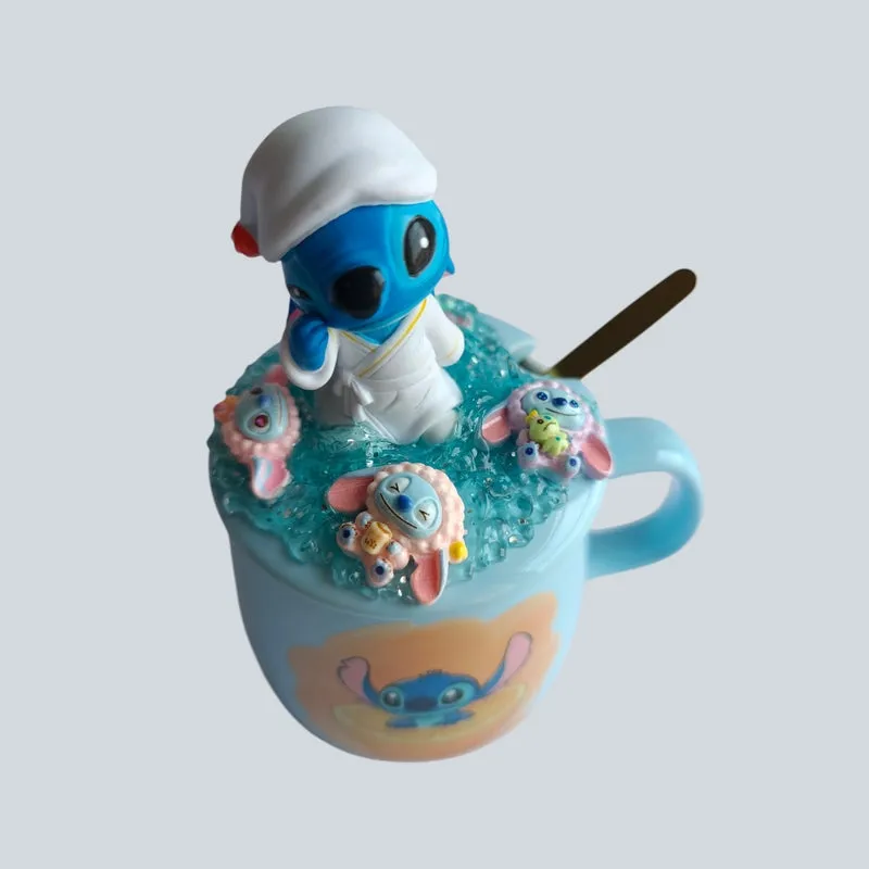 Top angled view of blue mug with sculpted Stitch lid and spoon