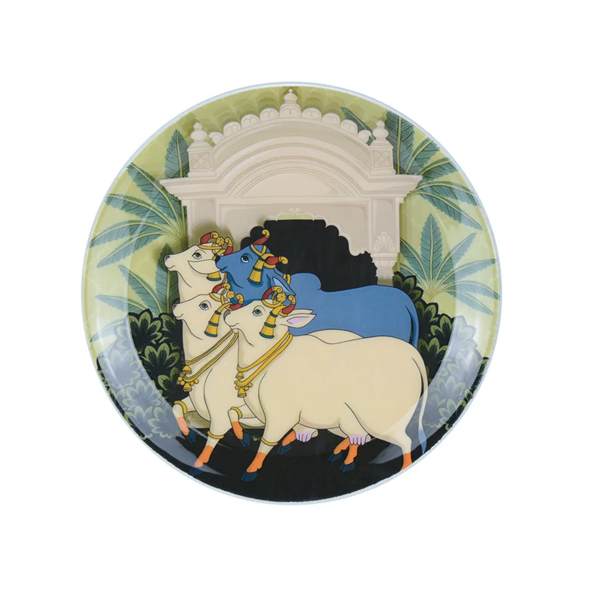 Round wall plate featuring decorated cows against a leafy architectural scene