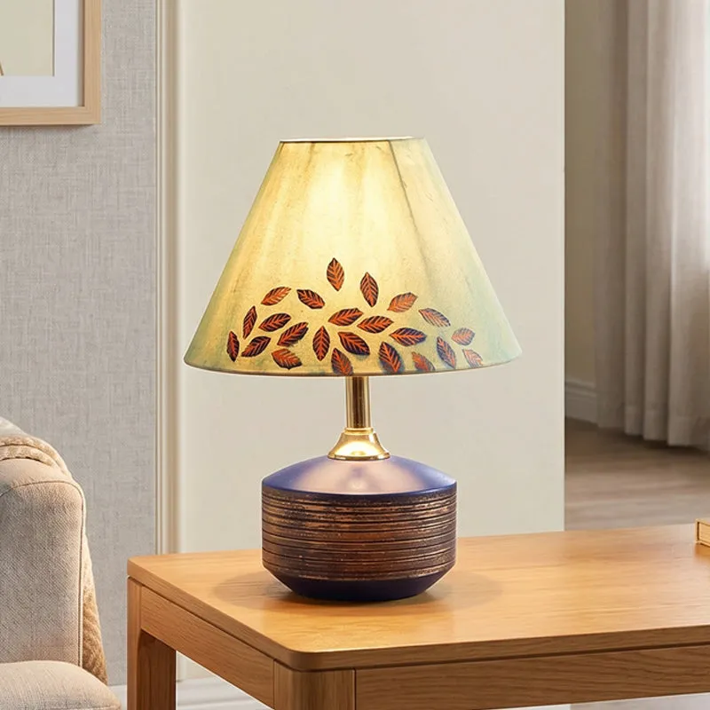 Leaf motif table lamp placed on a side table in a living room setting
