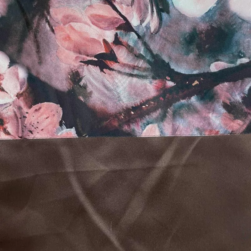 Close-up of floral printed curtain top with plain brown lower panel