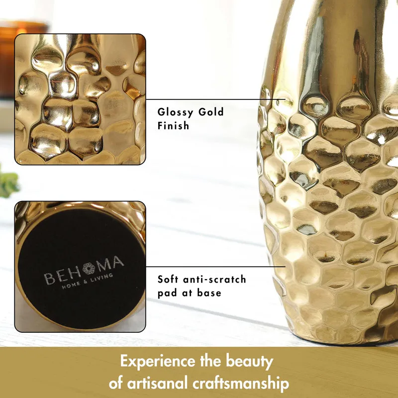Close-up of the hammered gold metal vase surface and base