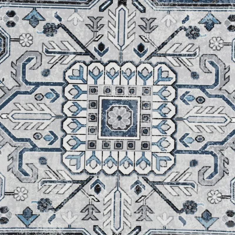 Close-up of the carpet's central geometric motif in blue and grey