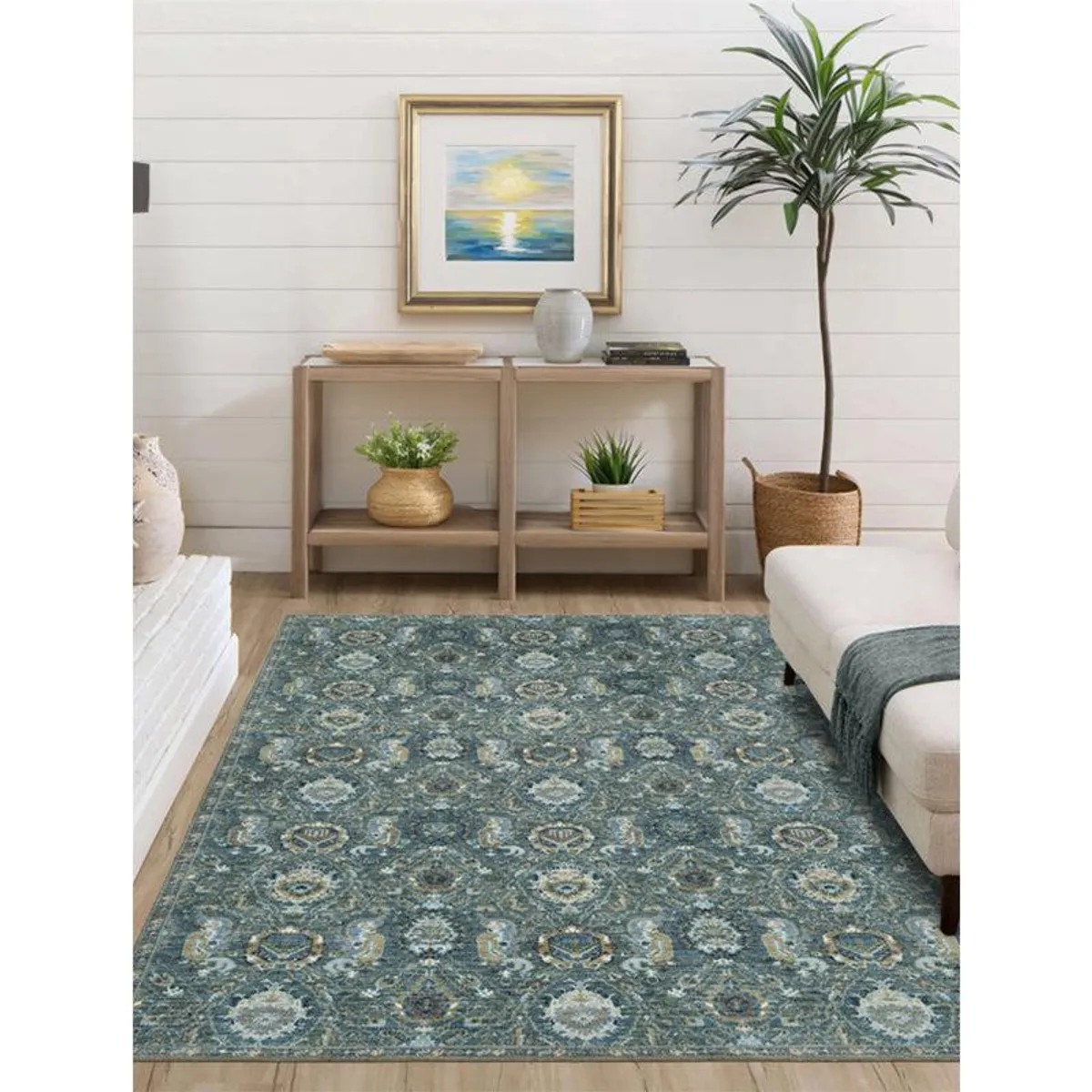 Dark green rectangular carpet with ornate blue and beige ethnic motifs in a living room