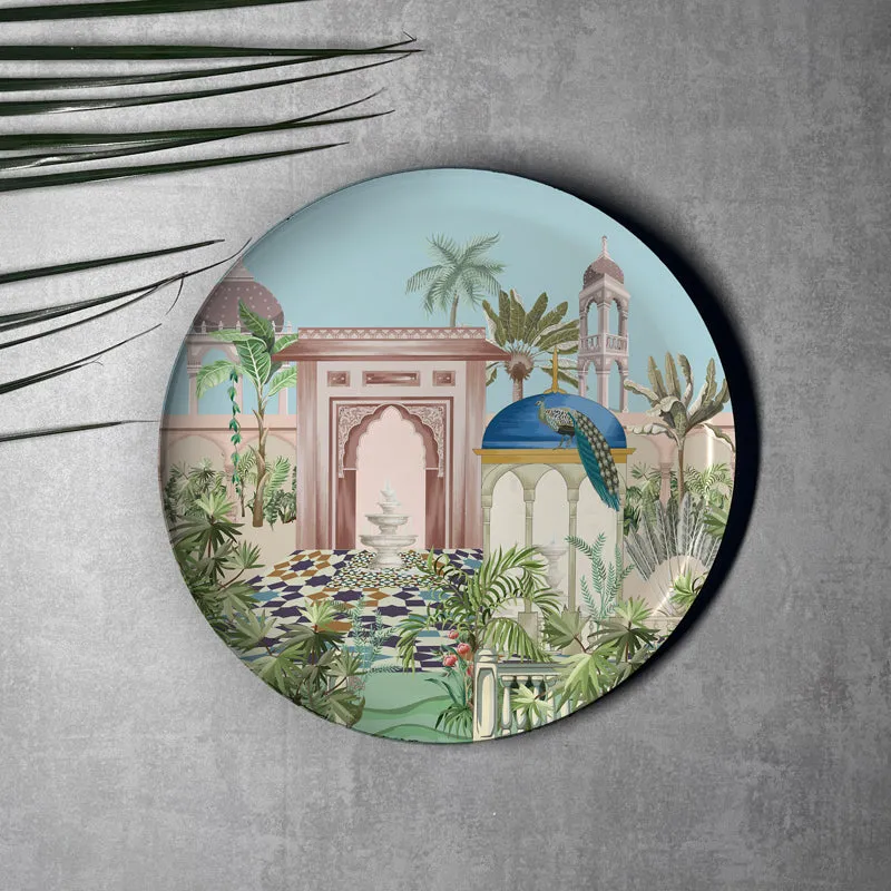 Round wall plate with Mughal garden scene, arches, foliage and peacock