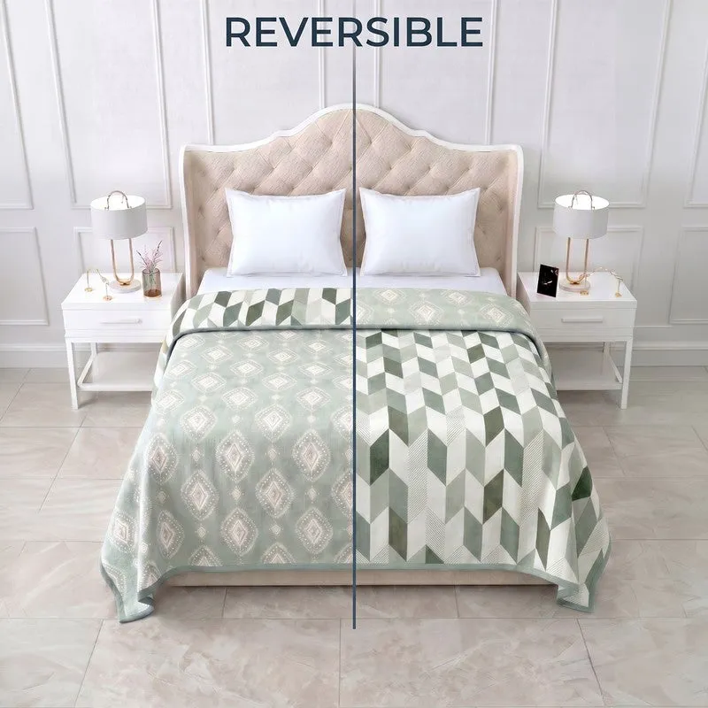 Bed styled with the dohar showing both reversible printed sides
