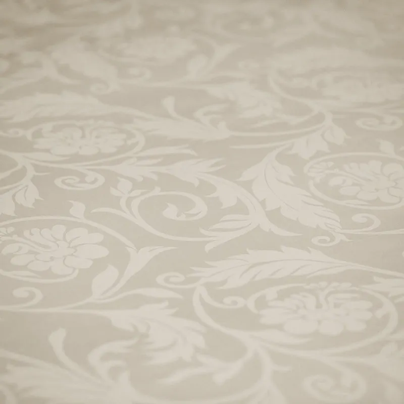 Close-up of beige floral jacquard pattern on bedsheet fabric