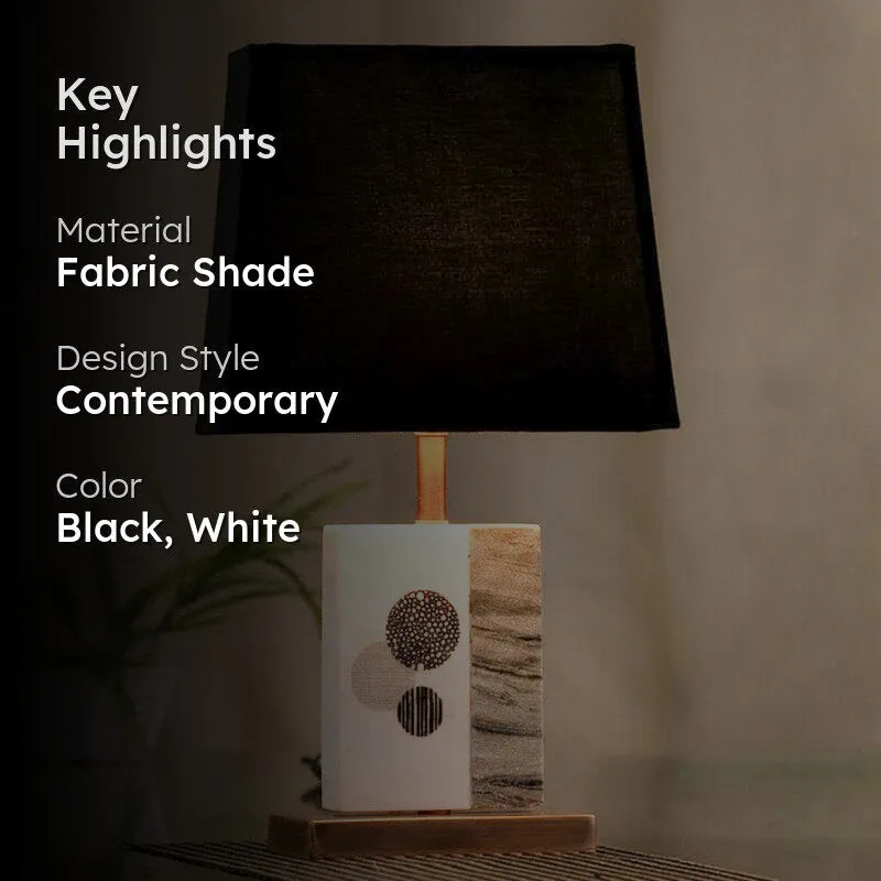 Black shade table lamp with marble base and copper-toned accents, highlight image