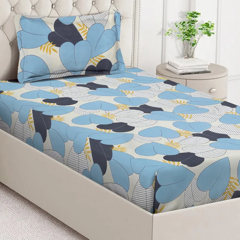 Close view of blue floral bedsheet with large abstract leaf motifs