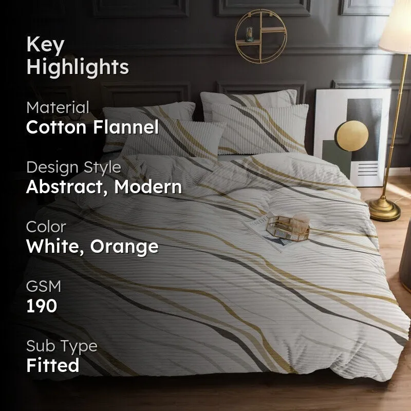 Styled bed with white abstract wave bedsheet and matching pillows in a modern bedroom