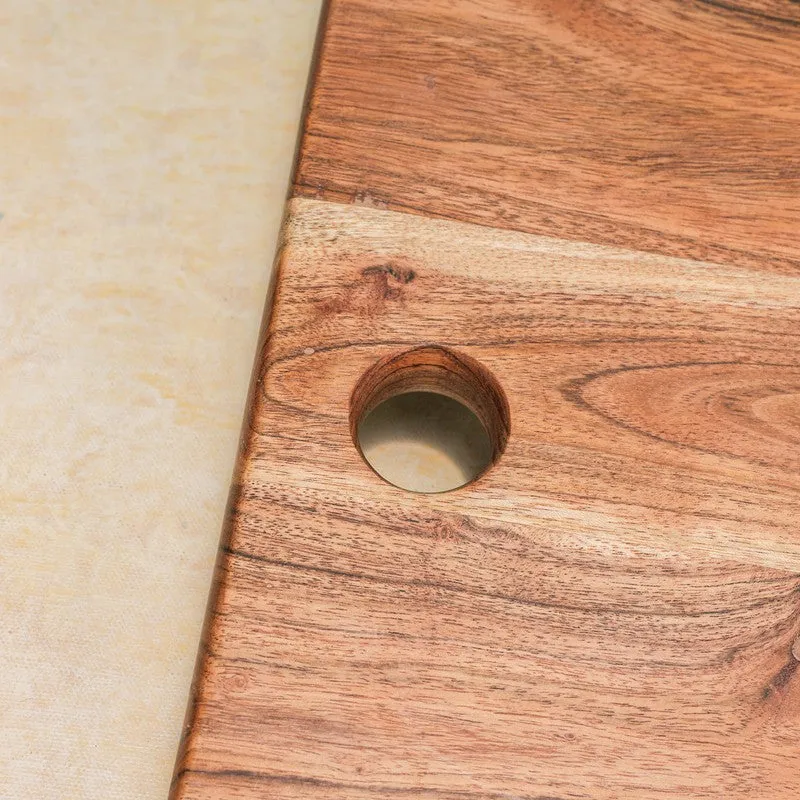 Close-up of the board's wood grain and round cut-out detail