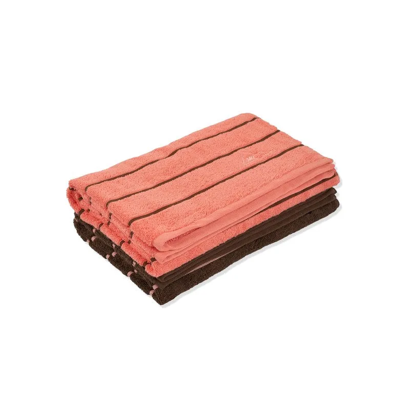 Folded orange and brown striped bath towels stacked together