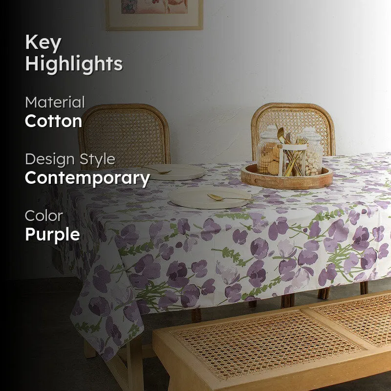 Purple floral table cover styled in a contemporary dining setting