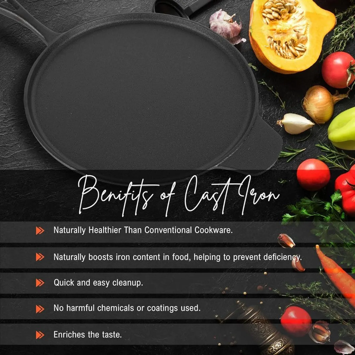 Plain black round cast iron dosa tawa with side grips on a dark surface