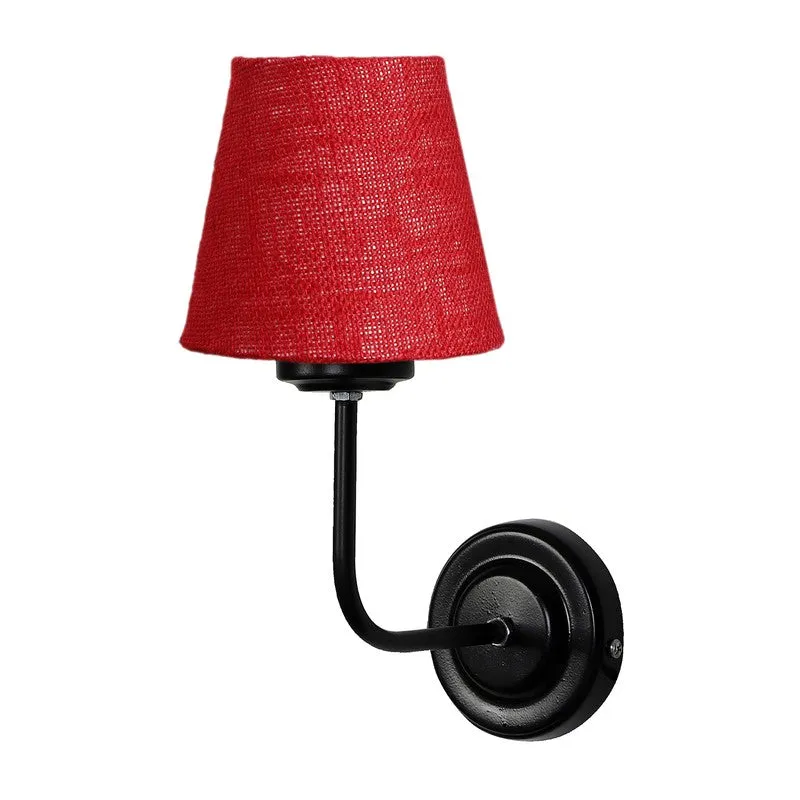 Angled view of red jute wall lamp with black iron wall plate
