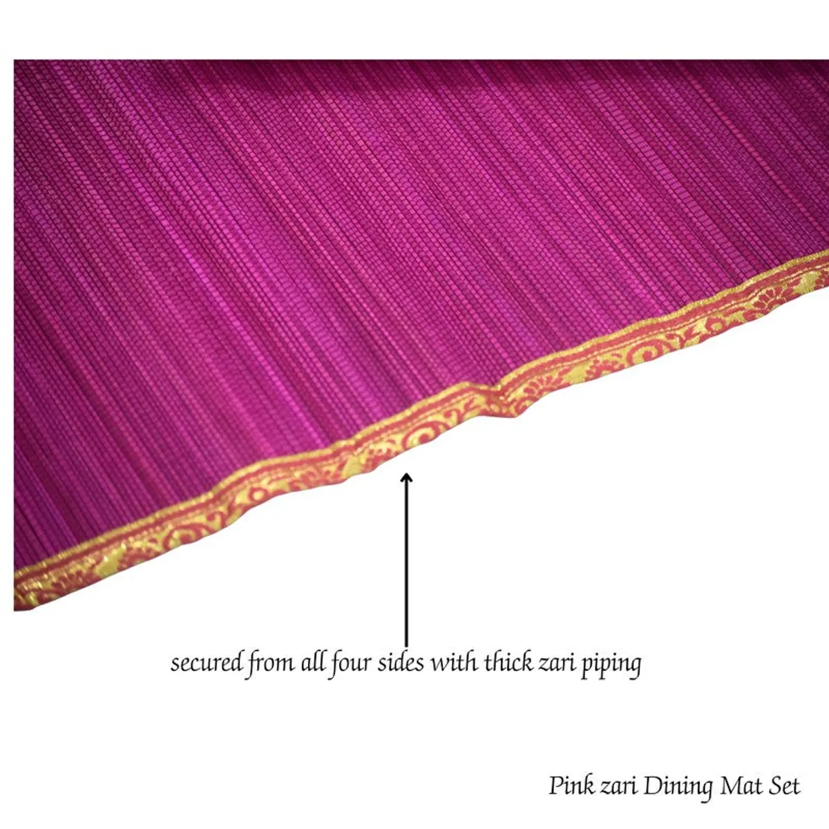 Close-up view of the pink runner with decorative gold zari piping