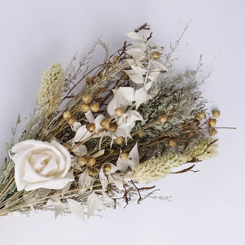 Close-up of the dried flower bouquet with white and beige botanicals