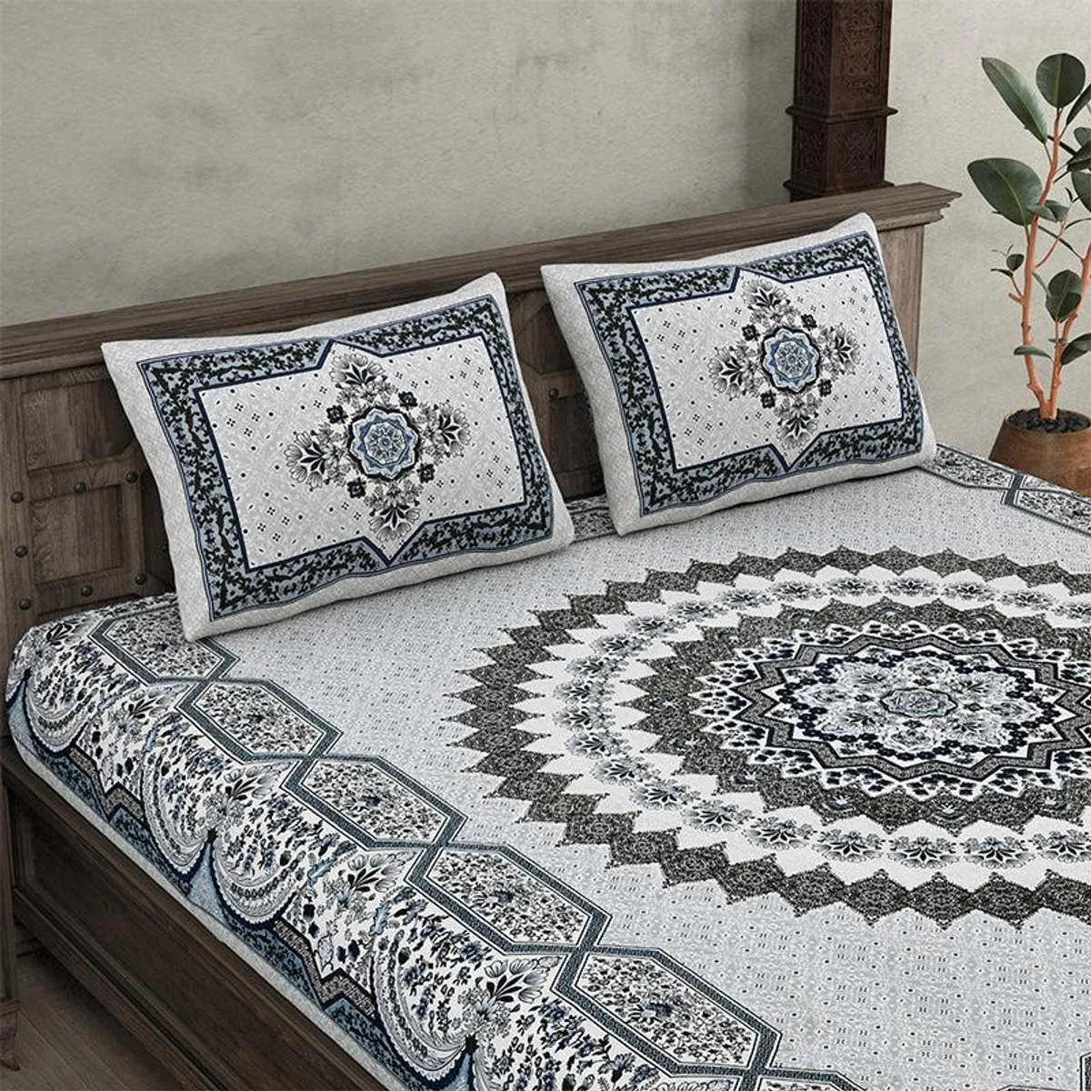 King bed styled with grey ethnic bedsheet and two printed pillow covers