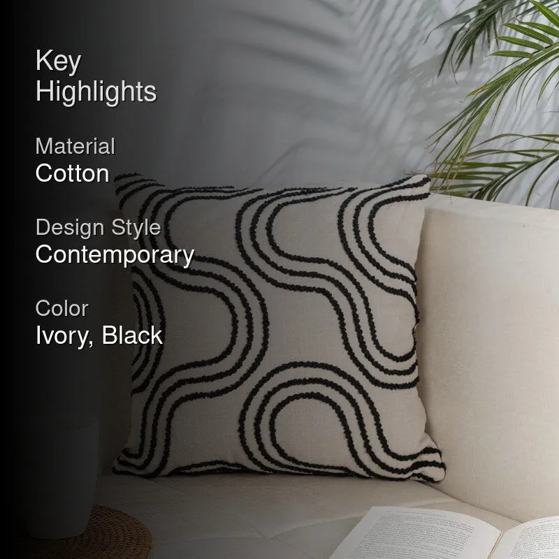 Styled sofa scene with ivory cushion cover featuring black abstract wave pattern