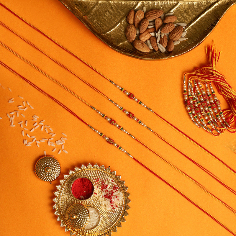 Swastika Om Rakhi with Roli Chawal - Thirteen Piece Set