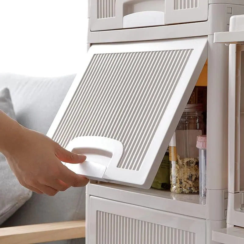 Close-up of the white organizer's ribbed flip-down door being opened