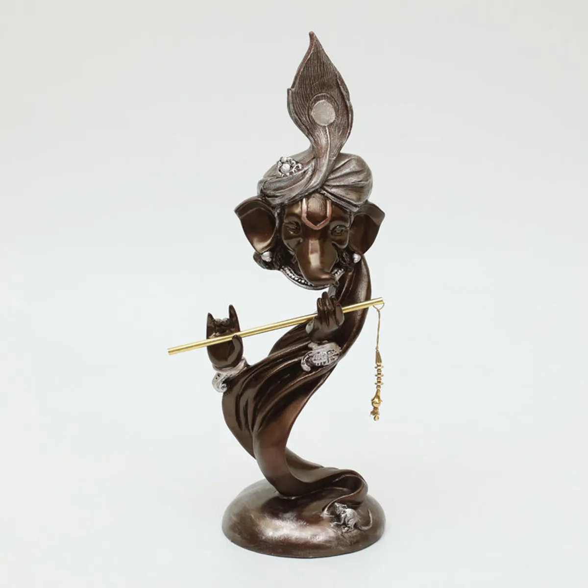 Front view of a brown Ganesha showpiece with metallic detailing on a white background