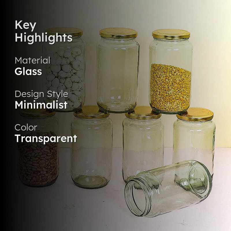 Transparent glass jars with gold-coloured lids arranged with stored ingredients