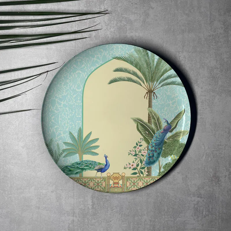 Round wall plate with archway, palm tree and two peacocks