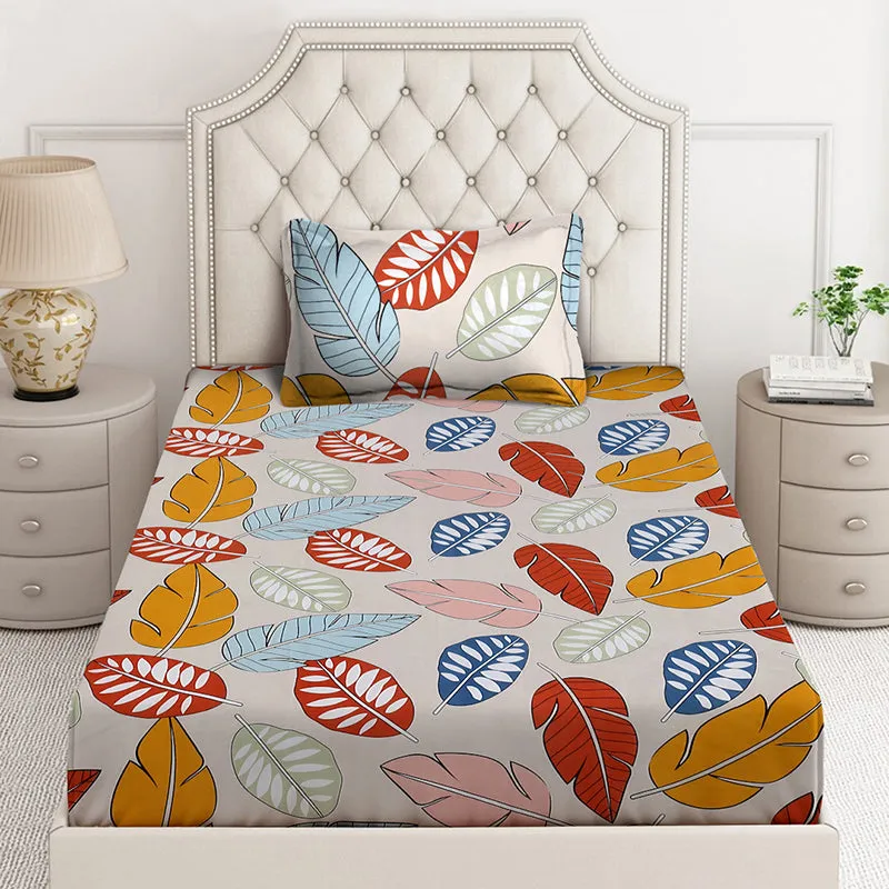 Front view of tropical leaf print bedsheet on a bed