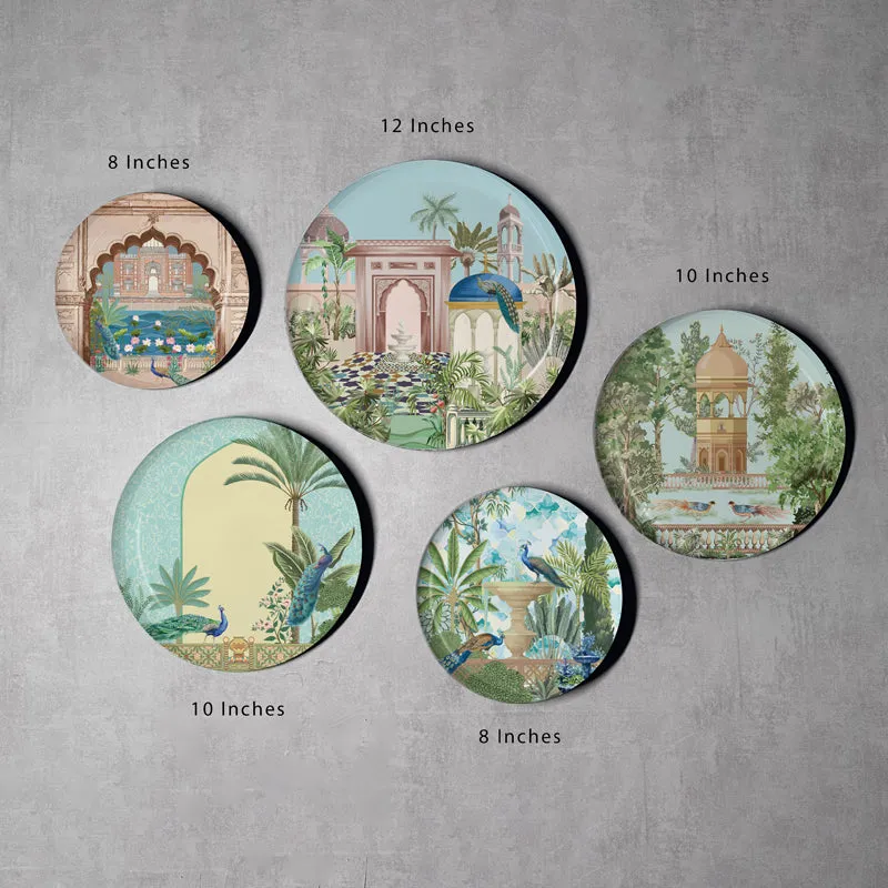 Set of five round decorative wall plates arranged together