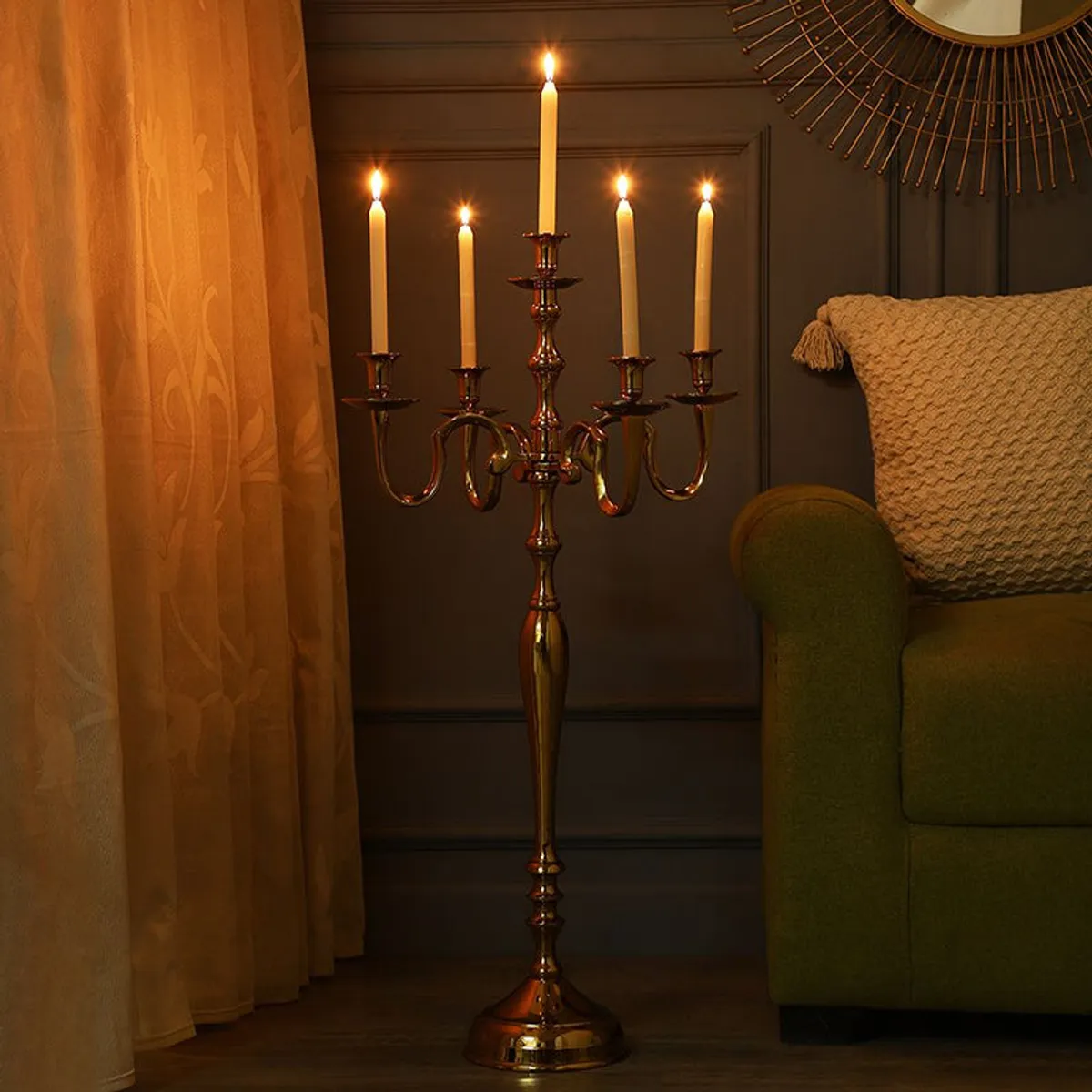Gold multi-arm candle holder displayed with lit candles