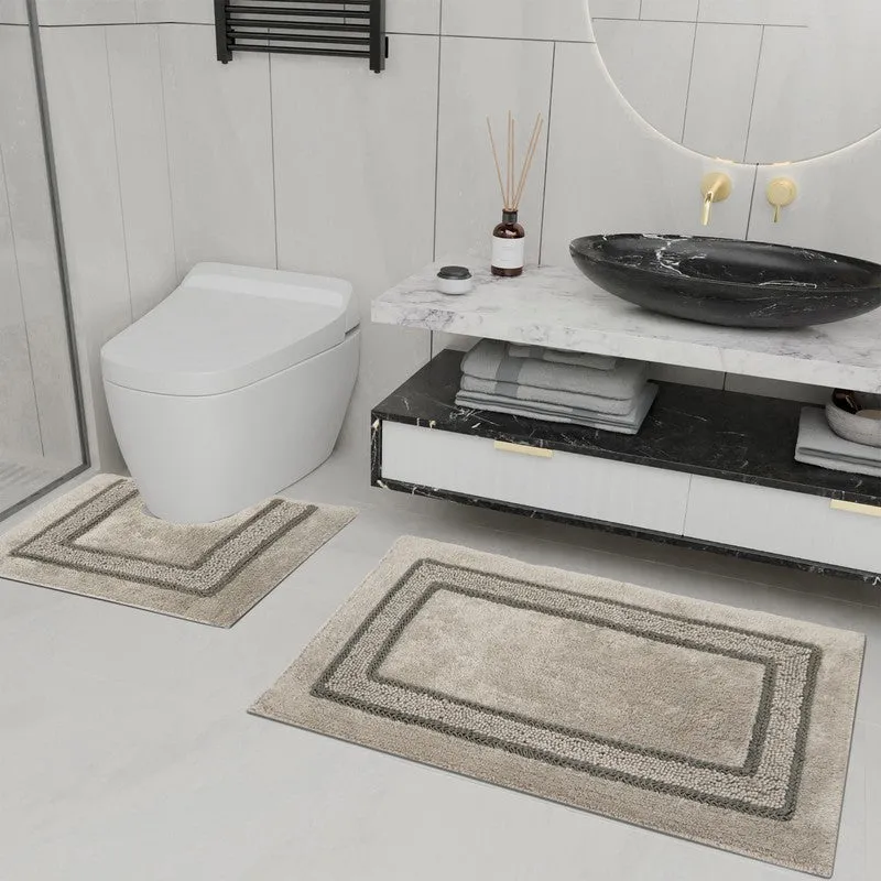 Brown rectangular bath mat and smaller counter mat placed on a modern bathroom floor