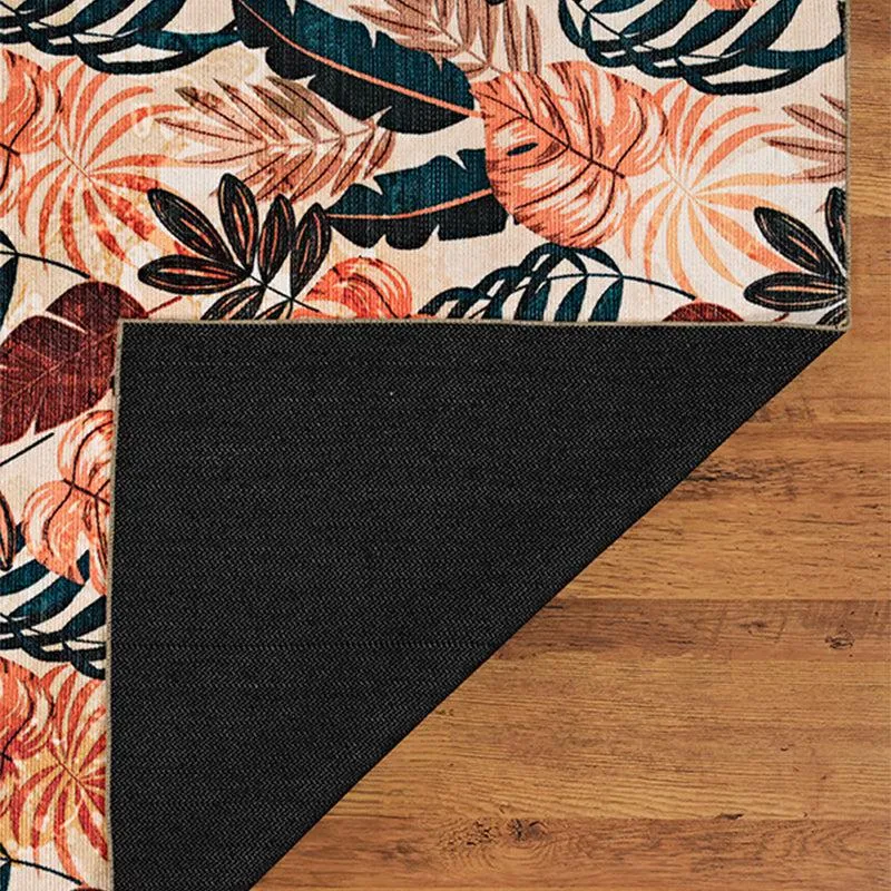 Folded corner of the carpet showing black underside backing