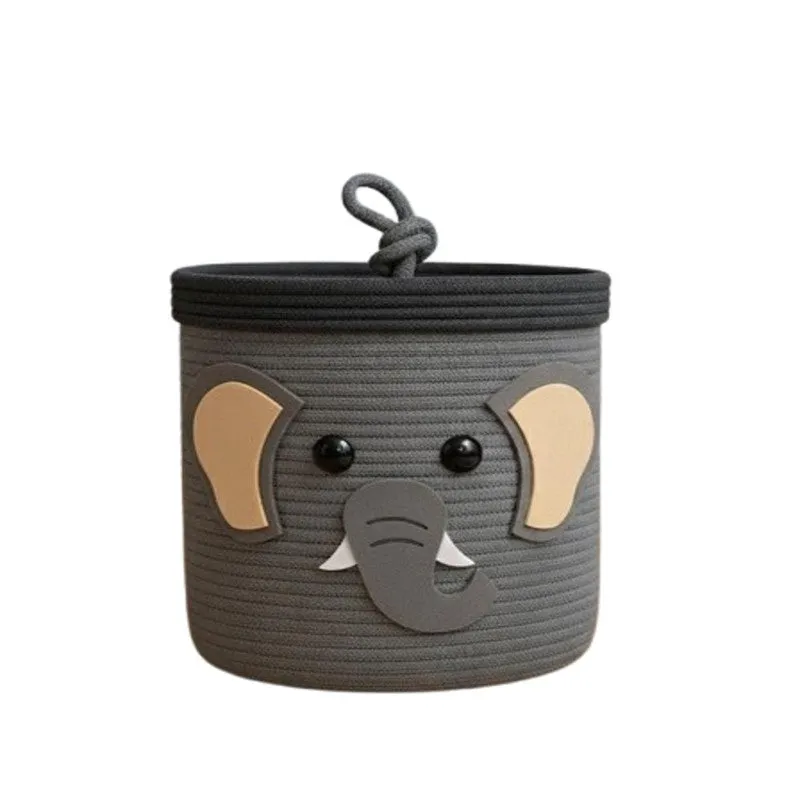 Grey cotton storage basket with elephant face motif and lid on white background