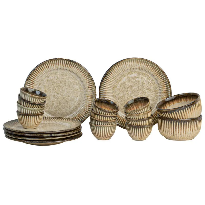 Beige ceramic dinner set displayed against a white background