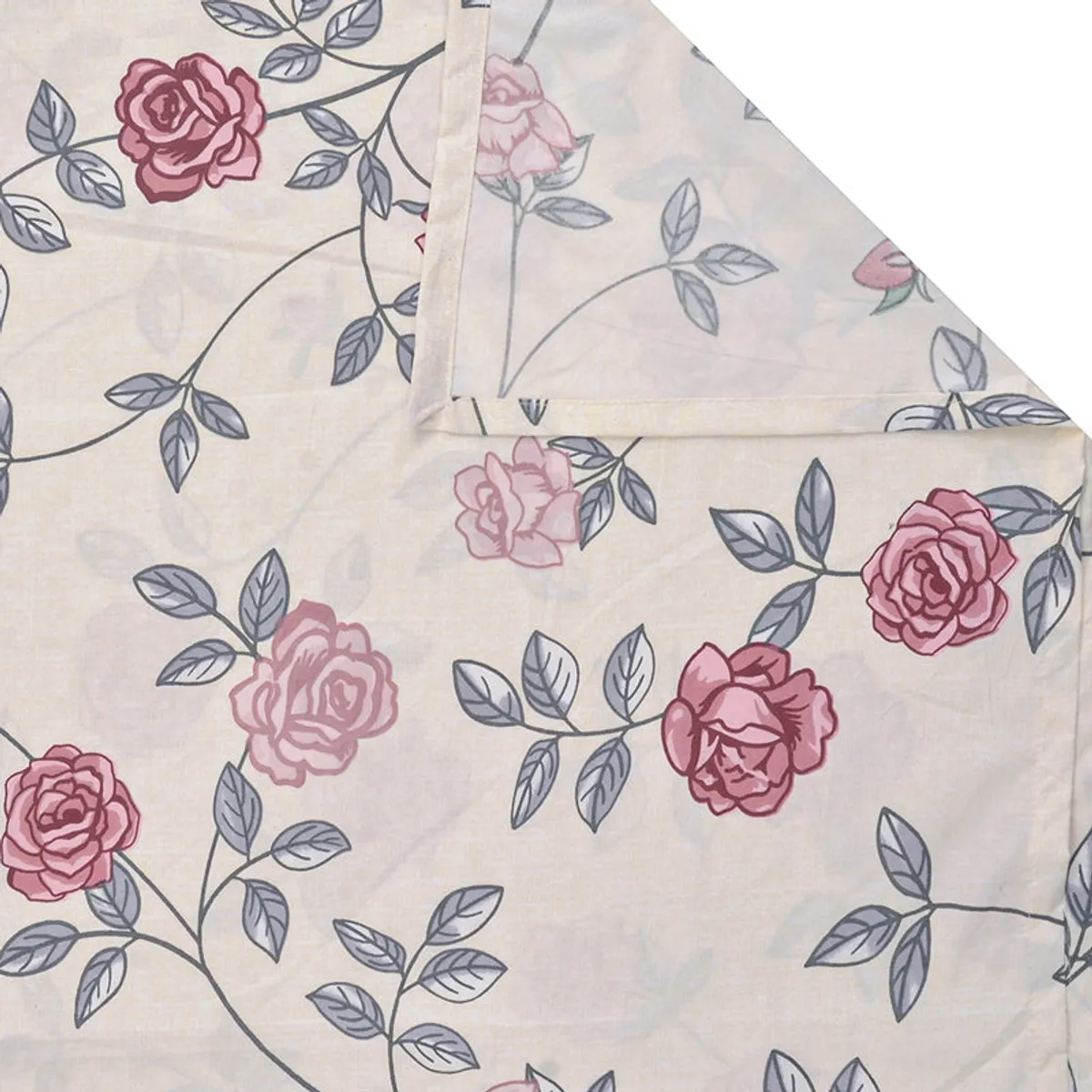 Folded corner of white floral diwan bedsheet with pink rose print