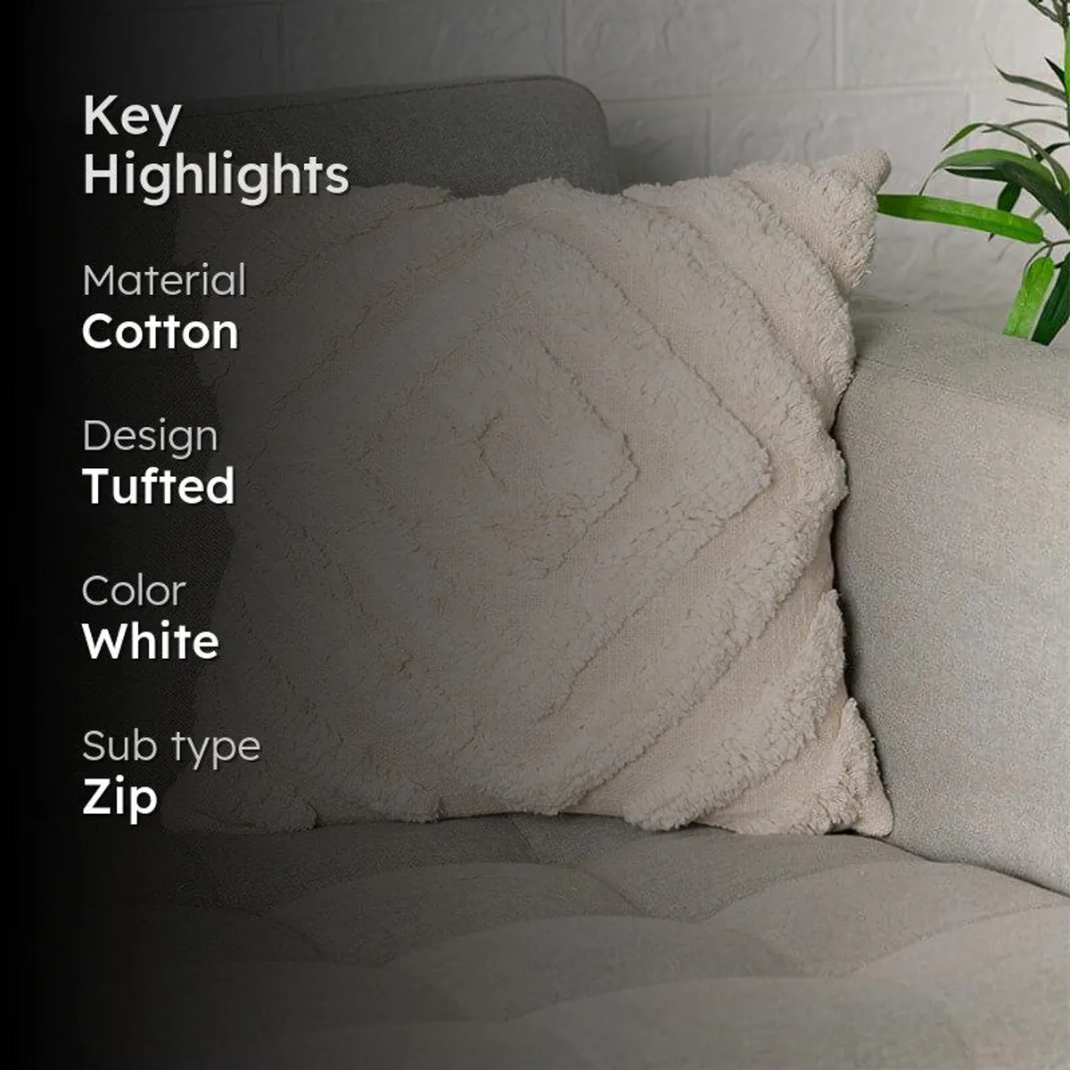 Close view of an ivory tufted cushion cover resting on a grey sofa