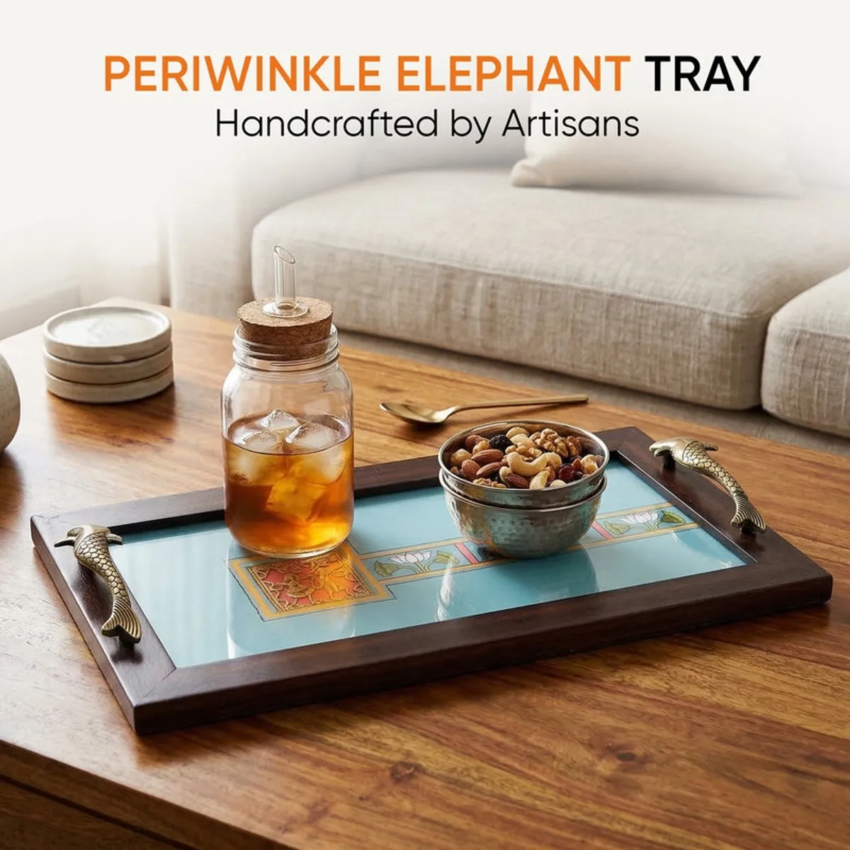 Blue serving tray holding a drink and snacks on a wooden coffee table