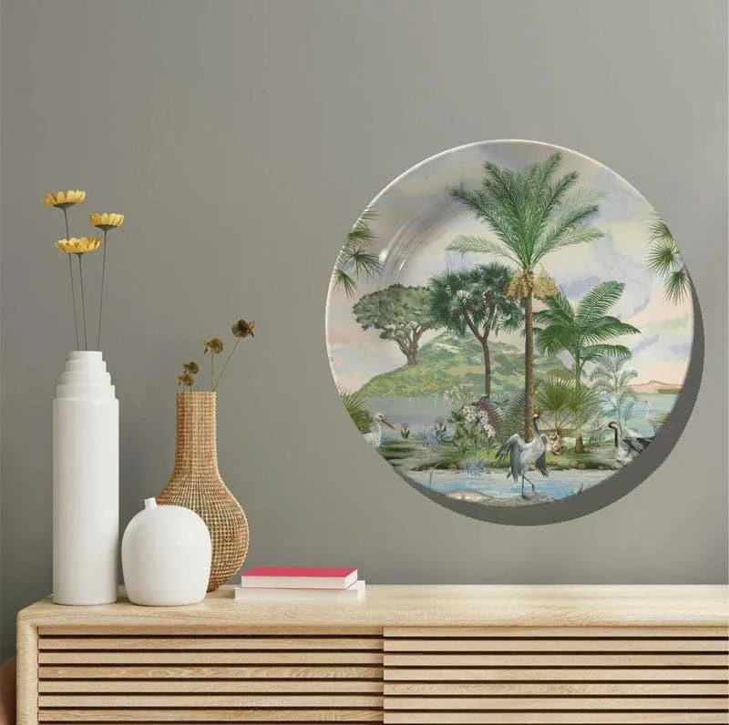 Round tropical landscape wall plate displayed above a wooden console