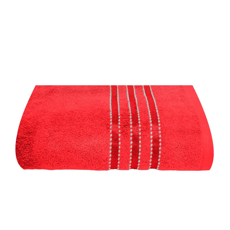 Red bath towel laid flat with striped detailing at the centre