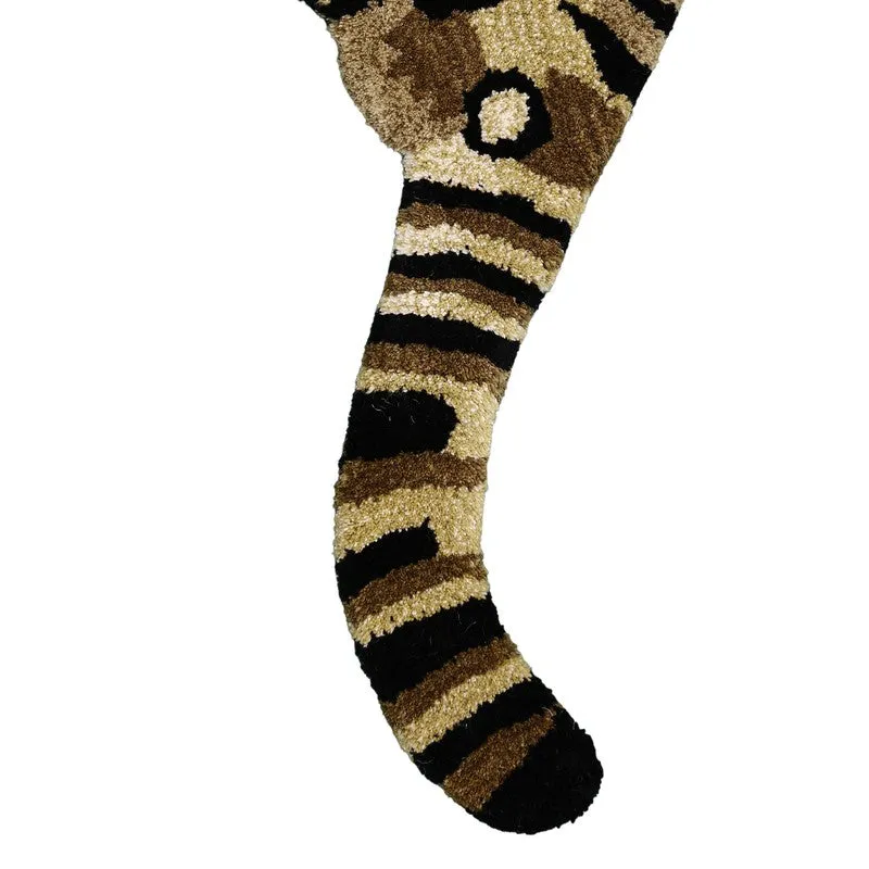 Close-up of the tiger carpet's striped tail and rounded edge