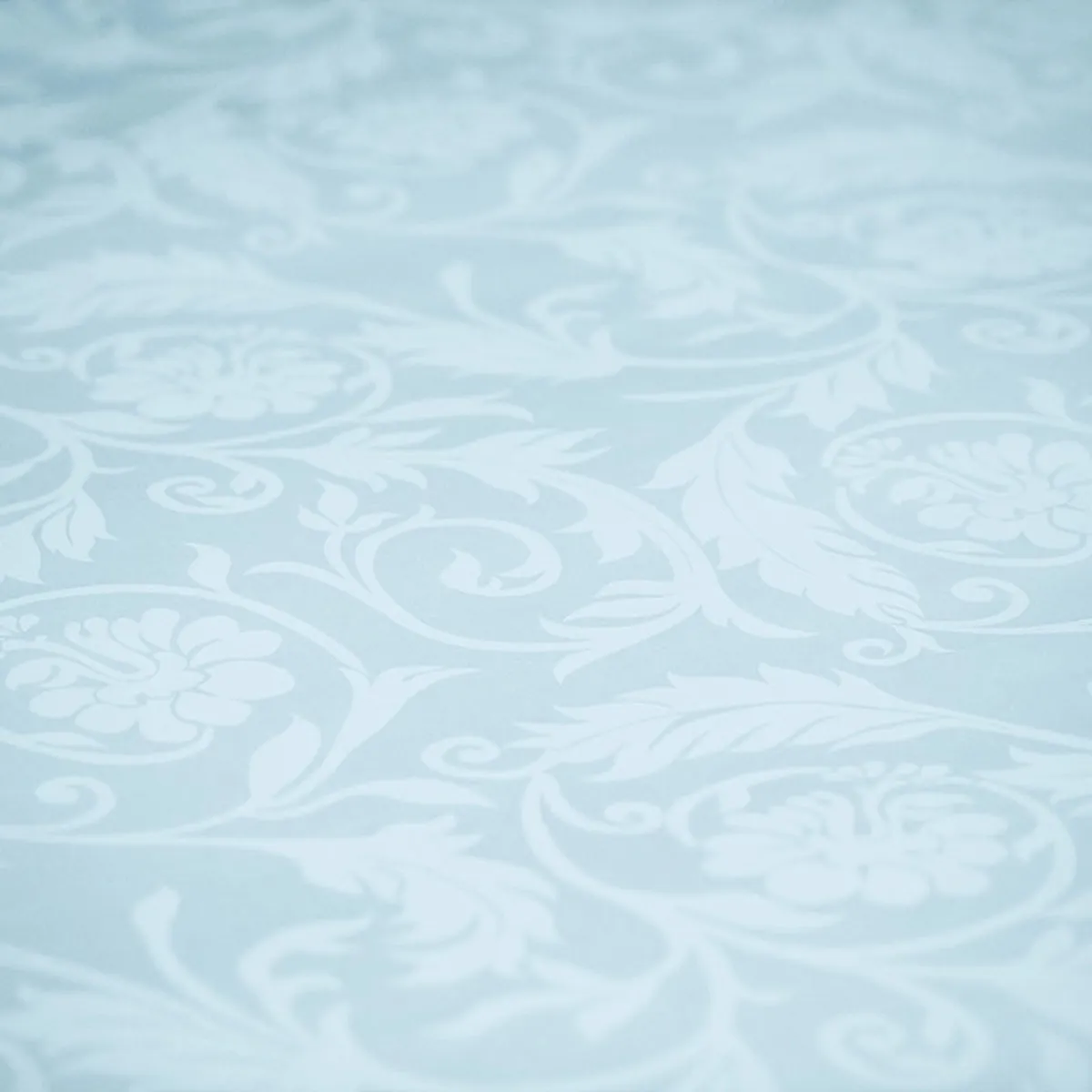 Close-up of the pale blue floral jacquard fabric pattern
