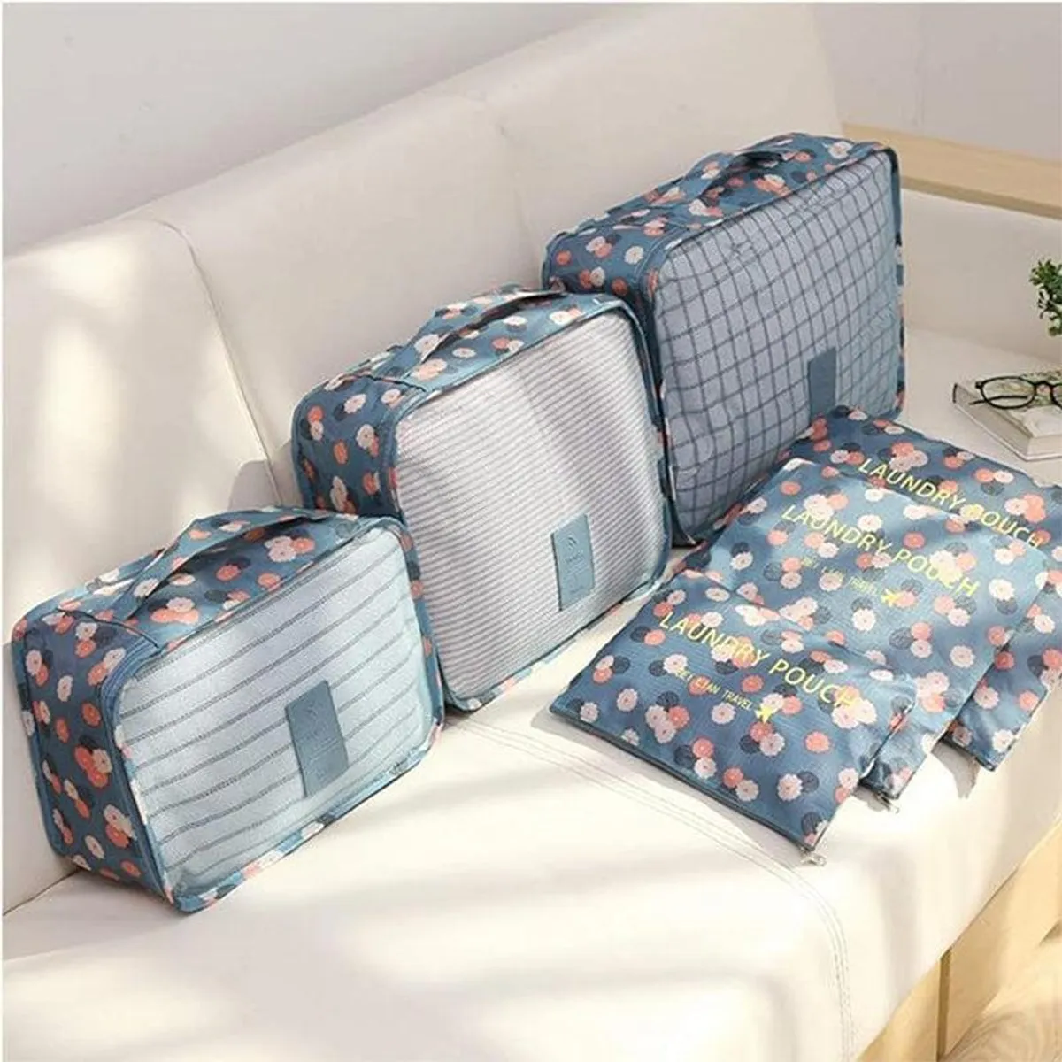 Blue floral organisers displayed on a light sofa