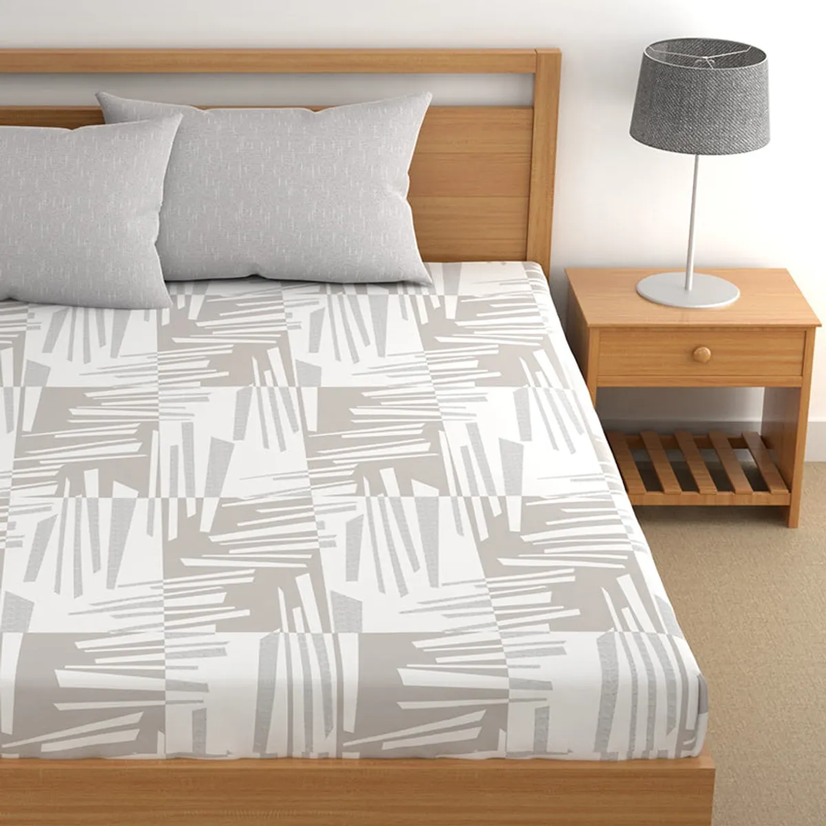 Close view of grey and white abstract bedsheet pattern on a bed